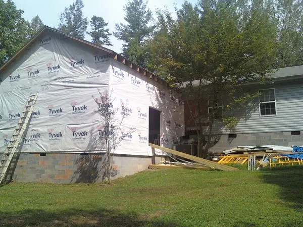 Tyvek wrapped gable on a new room addition beside an existing home in East Alton